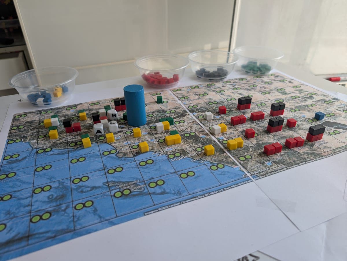 EMCE Firestorm tabletop game setup with map, tokens, and role materials